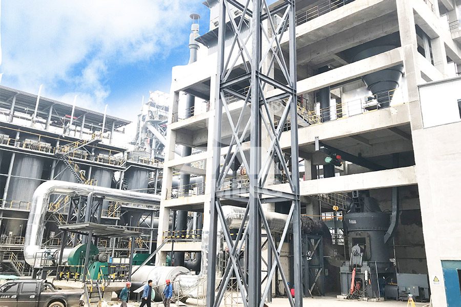 黎明重工LM系列立式辊磨机在水泥原料粉磨车间的工作现场图，设备结构紧凑